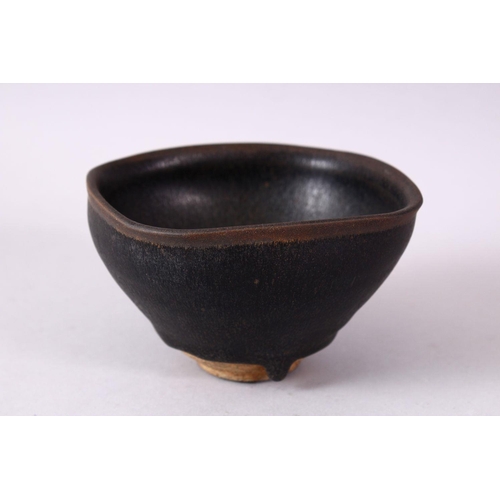 133 - A CHINESE JIANWARE TEA BOWL, with dark brown drip glazed decoration, 11cm diameter.