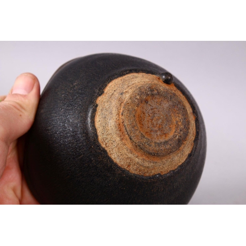 133 - A CHINESE JIANWARE TEA BOWL, with dark brown drip glazed decoration, 11cm diameter.