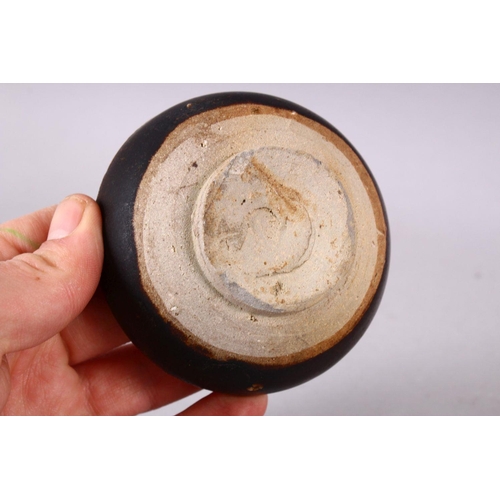 138 - A SMALL CHINESE TREACLE GLAZED CIRCULAR POTTERY BOX AND COVER, the cover with moulded dragon decorat... 