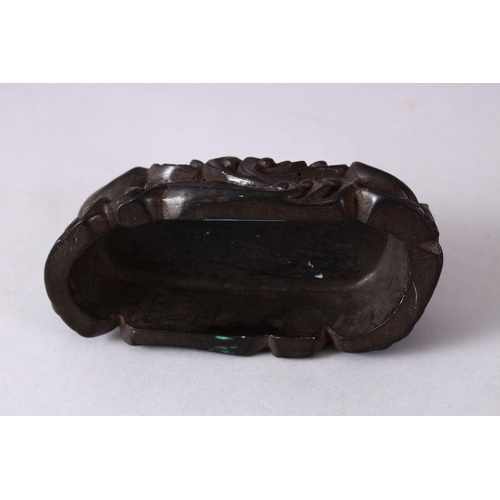 14 - A CHINESE MOULDED WAVE STAND, in the form of crashing waves, 12cm wide x 5.5cm.