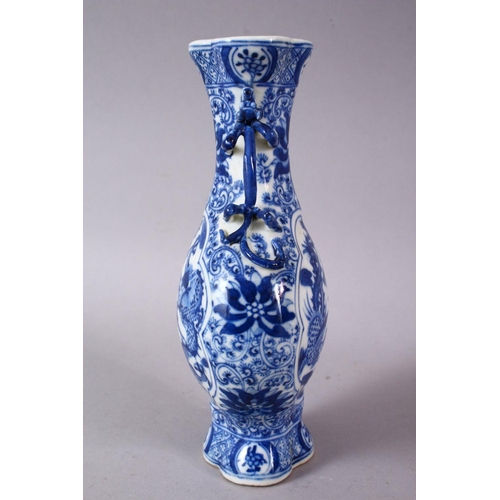 141 - A SMALL CHINESE BLUE AND WHITE PORCELAIN VASE, the neck with moulded animal form handles, the body d... 