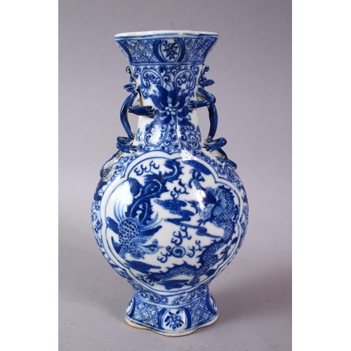 141 - A SMALL CHINESE BLUE AND WHITE PORCELAIN VASE, the neck with moulded animal form handles, the body d... 