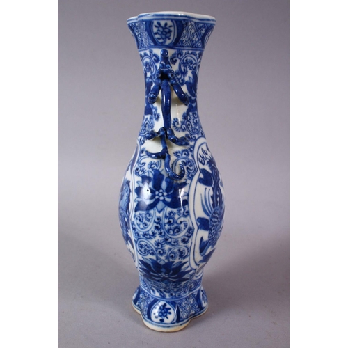 141 - A SMALL CHINESE BLUE AND WHITE PORCELAIN VASE, the neck with moulded animal form handles, the body d... 