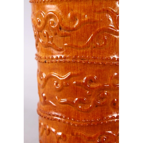 144 - A SMALL UNUSUAL CHINESE SIMULATED BAMBOO MOULDED POTTERY BRUSH POT, decorated with three bands of ph... 