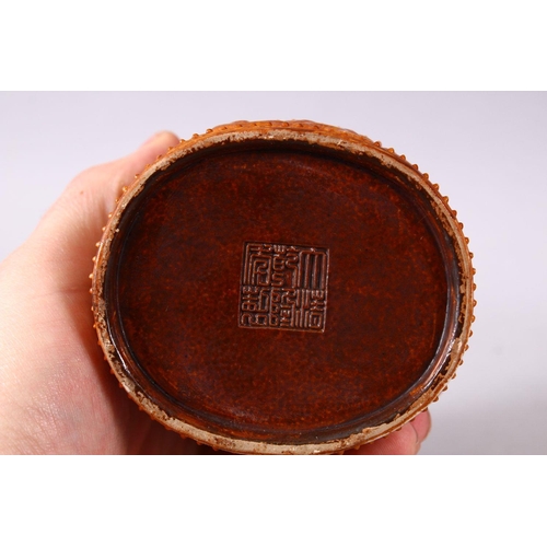 144 - A SMALL UNUSUAL CHINESE SIMULATED BAMBOO MOULDED POTTERY BRUSH POT, decorated with three bands of ph... 