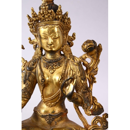 147 - A THAI GILT BRONZE SEATED FEMALE DIETY, 20cm high.