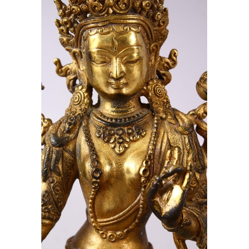 147 - A THAI GILT BRONZE SEATED FEMALE DIETY, 20cm high.