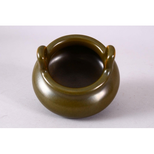 148 - A CHINESE SMALL TEA GLAZE TWIN HANDLED CENSER, impressed mark to base, 8.5cm diameter.