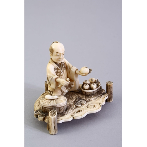 156 - A GOOD JAPANESE MEIJI PERIOD CARVED IVORY OKIMONO, the okimono carved to depict a seated fruit selle... 