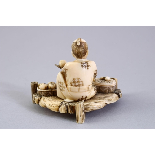 156 - A GOOD JAPANESE MEIJI PERIOD CARVED IVORY OKIMONO, the okimono carved to depict a seated fruit selle... 