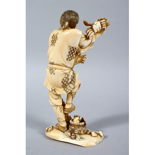 158 - A GOOD JAPANESE MEIJI PERIOD CARVED IVORY OKIMONO OF A FISHERMAN & CRABS, the fisherman stood aside ... 