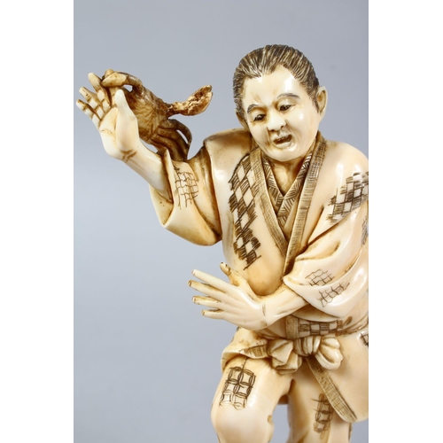 158 - A GOOD JAPANESE MEIJI PERIOD CARVED IVORY OKIMONO OF A FISHERMAN & CRABS, the fisherman stood aside ... 