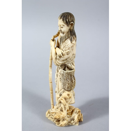 159 - A GOOD JAPPANESE MEIJI PERIOD CARVED IVORY OKIMONO - WAYFAIRER, the man stood leaning upon a stylize... 