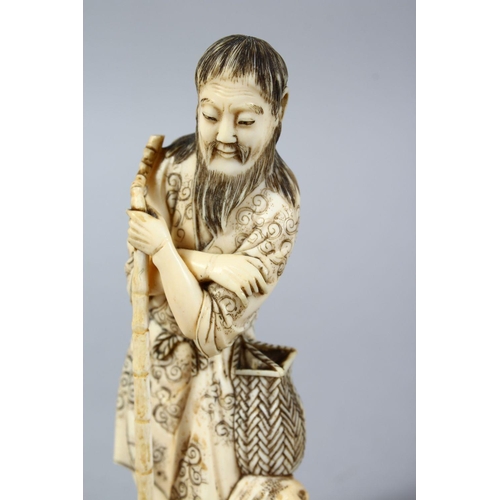 159 - A GOOD JAPPANESE MEIJI PERIOD CARVED IVORY OKIMONO - WAYFAIRER, the man stood leaning upon a stylize... 