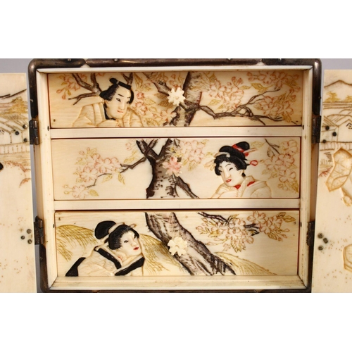 161 - A GOOD JAPANESE MEIJI PERIOD CARVED IVORY KODANSU, the cabinet carved to each side with scenes of fi... 