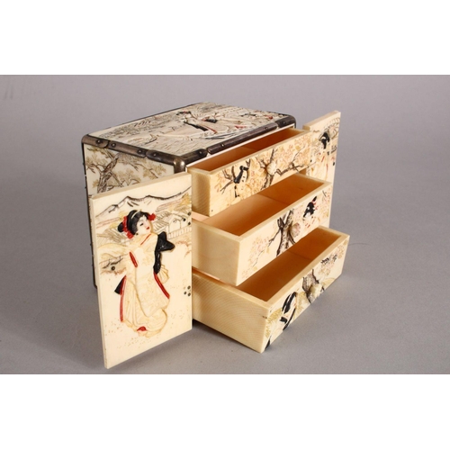 161 - A GOOD JAPANESE MEIJI PERIOD CARVED IVORY KODANSU, the cabinet carved to each side with scenes of fi... 