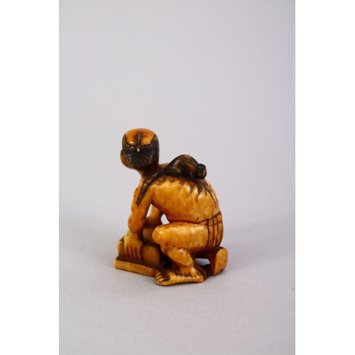 162 - A JAPANESE MEIJI PERIOD CARVED IVORY SMALL OKIMONO OF A RAT CATCHER, the man leaning over his trap w... 