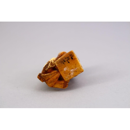 162 - A JAPANESE MEIJI PERIOD CARVED IVORY SMALL OKIMONO OF A RAT CATCHER, the man leaning over his trap w... 