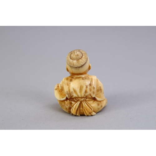 163 - A JAPANESE MEIJI PERIOD CARVED IVORY NETSUKE OF A BOY, the boy in a seated position clapping his han... 