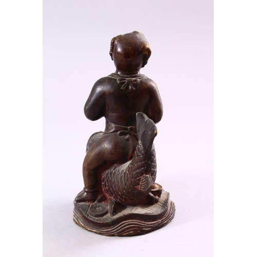 190 - A SMALL CHINESE BRONZE FIGURE OF A BOY SEATED UPON A CARP, 15cm high.