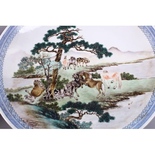 194 - A GOOD PAIR OF CHINESE REPUBLIC FAMILLE ROSE PORCELAIN PLATES, each decorated with figures upon hors... 