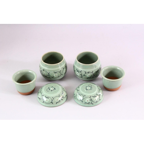 205 - THREE 20TH CENTURY KOREAN CELADON PORCELAIN TEA SET, the body decorated with formal floral display, ... 