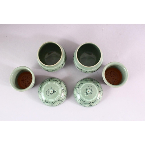 205 - THREE 20TH CENTURY KOREAN CELADON PORCELAIN TEA SET, the body decorated with formal floral display, ... 