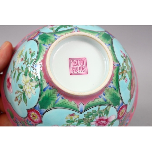 206 - A CHINESE PINK GROUND FAMILLE ROSE PORCELAIN BOWL, with panels of native flora on a blue ground, the... 