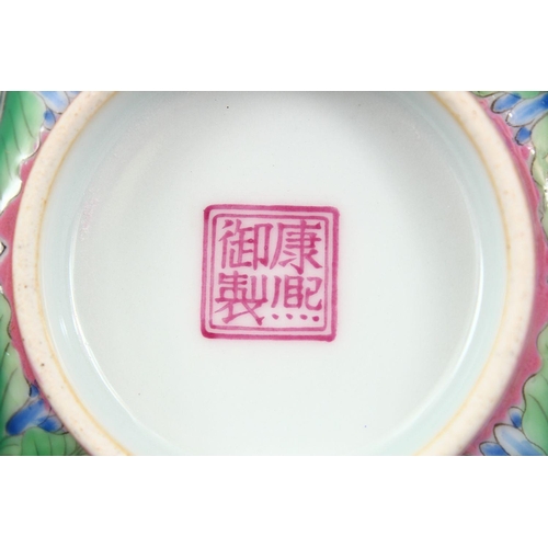 206 - A CHINESE PINK GROUND FAMILLE ROSE PORCELAIN BOWL, with panels of native flora on a blue ground, the... 