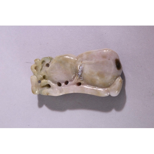 22 - A CHINESE CARVED AND PIERCED JADITE / HARDSTONE AMULET, in the form of a guord and animal, 6cm x 3cm... 