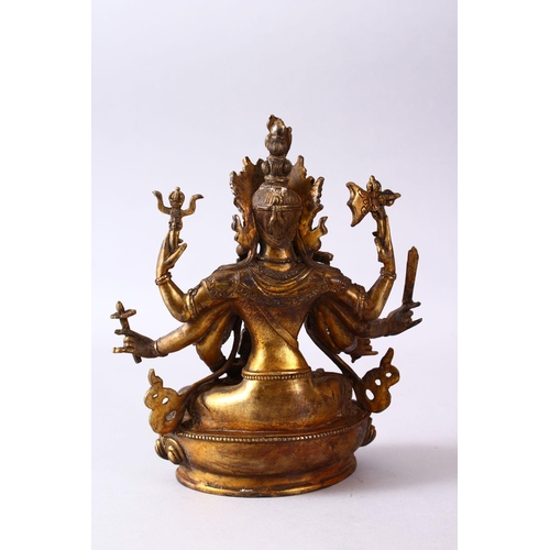 236 - A GOOD TIBETAN GILT BRONZE FIGURE OF A MULTI ARMED DIETY, inlaid with semi precious stones, 22.5cm h... 