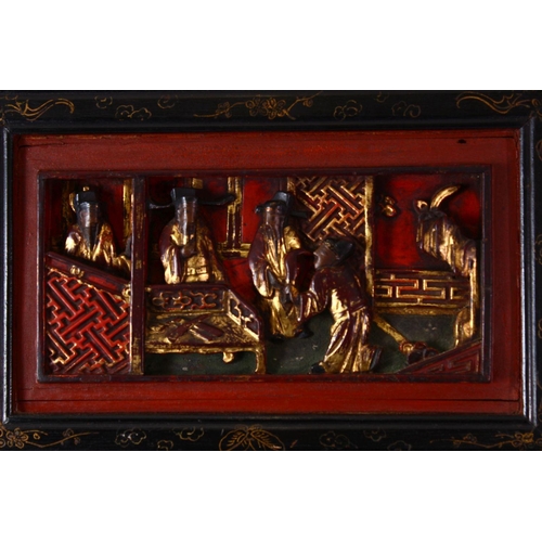 238 - A CHINESE RECTANGULAR MIRROR, with carved gilded and lacquer frame, 86cm x 31cm.