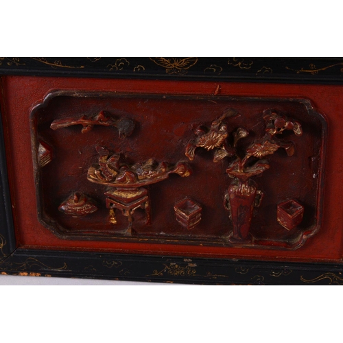 238 - A CHINESE RECTANGULAR MIRROR, with carved gilded and lacquer frame, 86cm x 31cm.