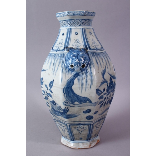 242 - A CHINESE YUAN STYLE BLUE & WHITE TWIN HANDLE PORCELAIN VASE, decorated with scenes of cranes amongs... 