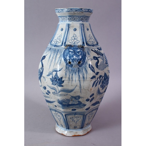 242 - A CHINESE YUAN STYLE BLUE & WHITE TWIN HANDLE PORCELAIN VASE, decorated with scenes of cranes amongs... 