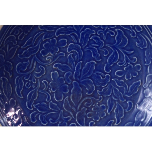 243 - A CHINESE SONG STYLE BLUE GROUND CARVED FLORAL PORCELAIN DISH, 20.5cm