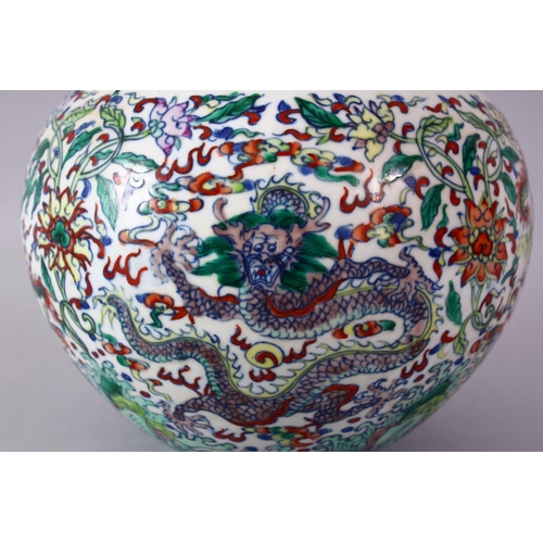 246 - A CHINESE DOUCAI DECORATED PORCELAIN DRAGON BOTTLE VASE, decorated with scenes of dragons amongst fo... 