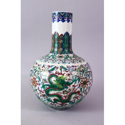 246 - A CHINESE DOUCAI DECORATED PORCELAIN DRAGON BOTTLE VASE, decorated with scenes of dragons amongst fo... 