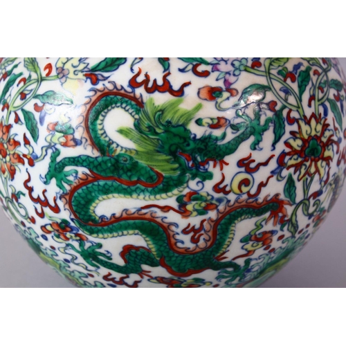 246 - A CHINESE DOUCAI DECORATED PORCELAIN DRAGON BOTTLE VASE, decorated with scenes of dragons amongst fo... 