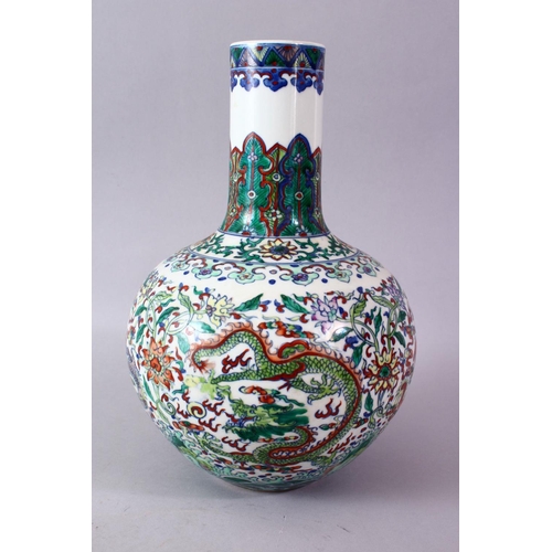 246 - A CHINESE DOUCAI DECORATED PORCELAIN DRAGON BOTTLE VASE, decorated with scenes of dragons amongst fo... 