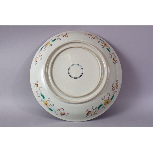 247 - A CHINESE FAMILLE ROSE PORCELAIN CHARGER, With decoration depicting displays of native flora, with b... 