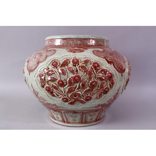 249 - A LARGE CHINESE MING STYLE COPPER RED CARVED PORCELAIN VASE, with carved flroal panels and border de... 