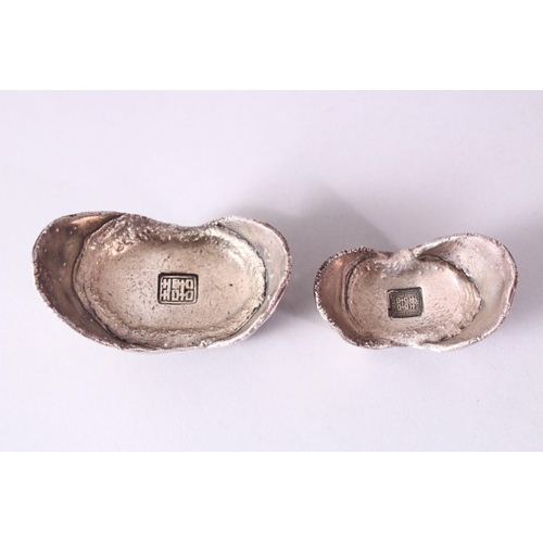 25 - TWO PIECES OF CHINESE WHITE METAL POSSIBLY SILVER SHOE CURRENCY, 7cm and 6.5cm.