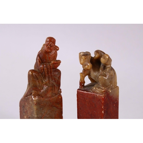 26 - A PAIR OF 19TH / 20TH CENTURY CHINESE CARVED SOAPSTONE SEALS, one of monkeys upon horse, the other o... 