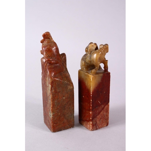 26 - A PAIR OF 19TH / 20TH CENTURY CHINESE CARVED SOAPSTONE SEALS, one of monkeys upon horse, the other o... 