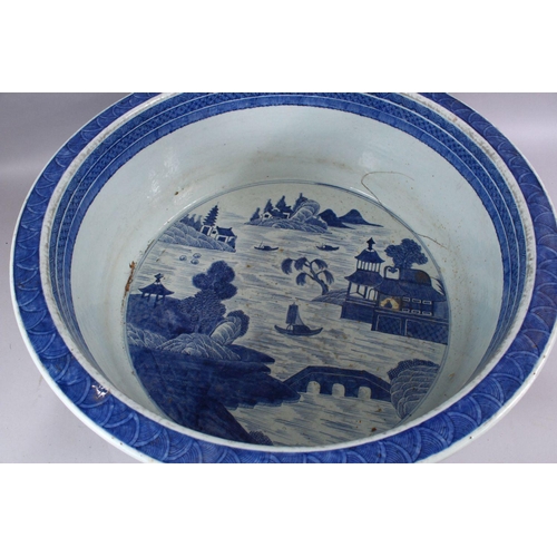 269 - A LARGE 18TH CENTURY CHINESE QIANLONG BLUE & WHITE PORCELAIN BASIN, decorated with views of village ... 