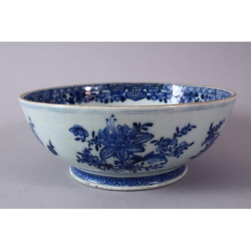 285 - A 18TH/19H CENTURY CHINESE POSSIBLE QIANLONG BLUE AND WHITE PORCELAIN BOWL, with native floral decor... 