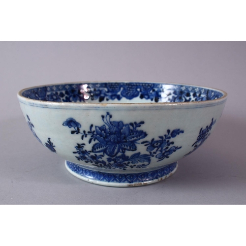 285 - A 18TH/19H CENTURY CHINESE POSSIBLE QIANLONG BLUE AND WHITE PORCELAIN BOWL, with native floral decor... 