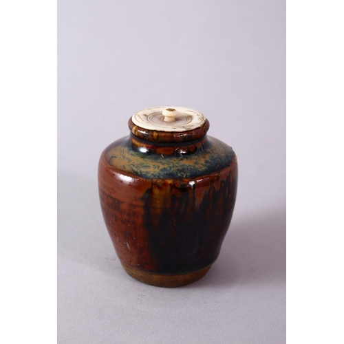 290 - A JAPANESE MEIJI PERIOD POTTERY TEA CADDY / JAR AND IVORY COVER, with a drip glaze base and ivory co... 