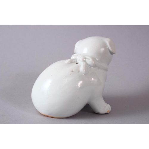 293 - A 19TH CENTURY JAPANESE HIRADO PORCELAIN MODEL OF A PUPPY in a seated pose, 10cm high, 13cm wide.